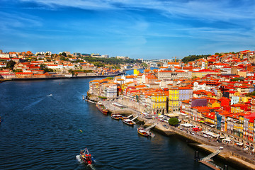 Old multi-colored houses on the embankment in the city of Porto, Portugal