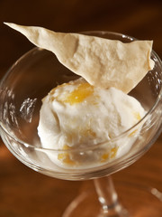 scoop of fruit ice cream in a glass