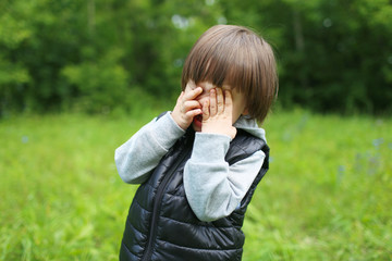 Portrait of crying 2 years child outdoors