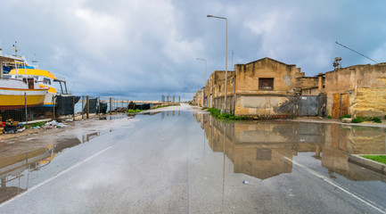 street view with reflection in Marsala, Italy