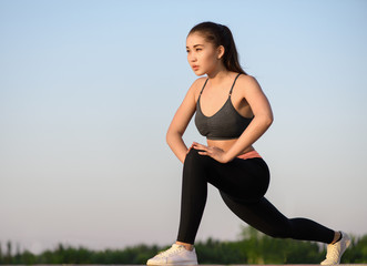 Asian woman doing exercise at the morning outdoor