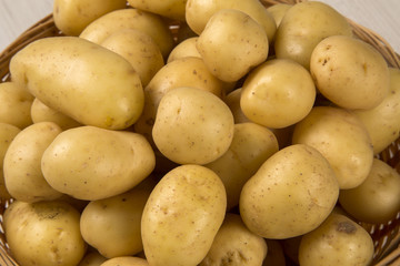 Some potatoes over a white background