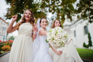 Stylish bridesmaids have fun with bride