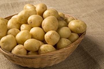Some potatoes over a wooden surface