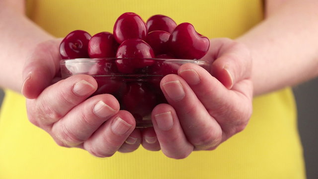 Woman Holding Cherry Bowl, Female Hands with Ripe Red Sweet Fruit as Healthy Eating, Dieting and Nutrition Concept.