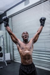 Naklejka premium Young Bodybuilder posing in front of the camera