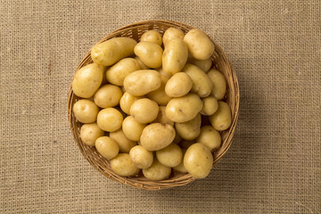 Some potatoes over a wooden surface