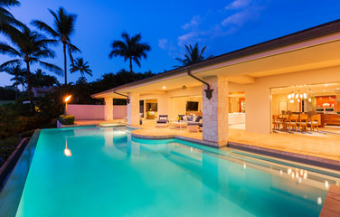 Obraz na płótnie Canvas Luxury Home with Pool at Sunset