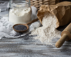 Ingredients for baking rye buns with poppy seeds, selective focus