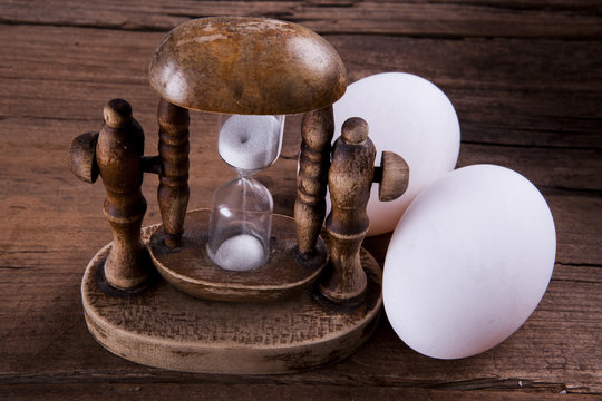 Vintage Egg Timer Shot Front On On A Wooden Background Rustic Look