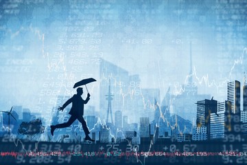 Composite image of businessman with umbrella