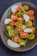 Colorful tomato salad with onion