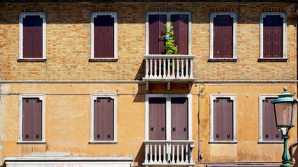 windows doors and terrace of ancient house in Murano