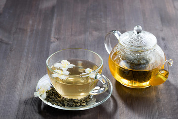 green tea with jasmin on wooden table