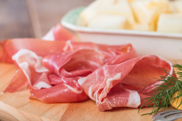 italian food with melon and prosciutto