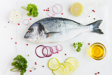 fresh raw dorado fish with spices