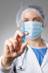 Female doctor with syringe