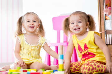 Kids playing with wooden blocks
