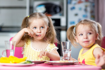 Children drinking and eating at daycare