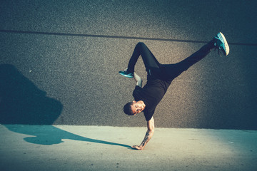BBoy doing handstand on street