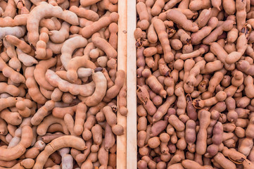 Sweet tamarind on wood plank.