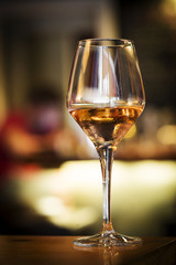 glass of rose wine on bar counter