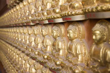 Photo sur Plexiglas Bouddha image buddha row on wall