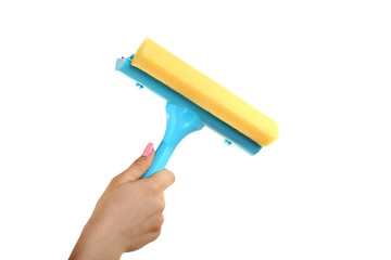 Tool for washing windows in a women`s hand on a solated white background