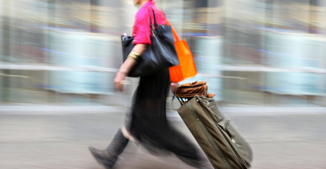 motion blurred business people walking on the street