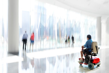 group and disabled people in the lobby business center