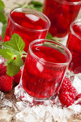Cold Raspberry drink with mint and ice, selective focus