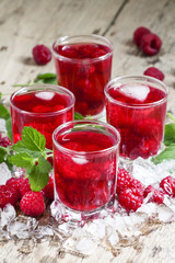 Cold Raspberry drink with mint and ice, selective focus