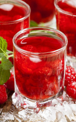 Cold Raspberry drink with mint and ice, selective focus