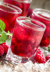 Cold Raspberry drink with mint and ice, selective focus