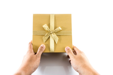 Hand give golden gift box with golden bow