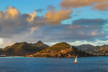 Sailboat in bay at sunset in Saint Martin