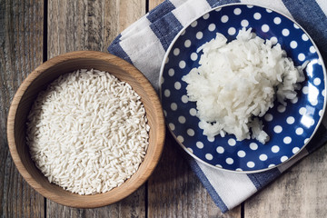 Sticky rice- prepered on blue, spotted plate, unprepered in wood