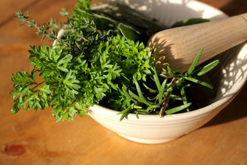 Herbs pestle mortar.
Selection of herbs in a pestle and mortar.