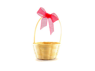 Wicker basket with red ribbon isolated on white background
