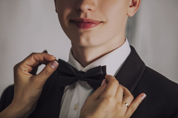 Man the groom in a wedding costume with butterfly smiles. © kuzmichstudio