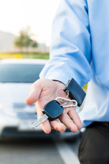 Car Keys. Seller hand giving keys