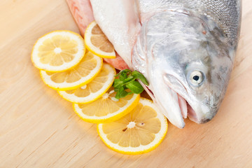 Whole trout on wooden cutting board