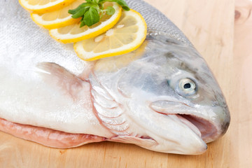 Whole trout on wooden cutting board