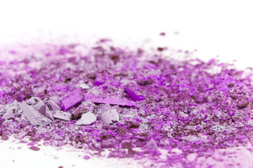Crushed eyeshadows on white background