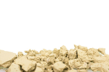 Crushed yellow eyeshadows on white background