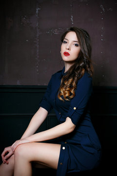 Cute Young Woman In Navy Blue Dress