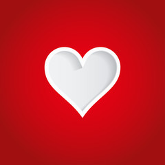 White heart cut out of red paper.