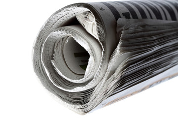 Newspaper.
Newspaper rolled up isolated on white background.