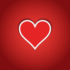 Red heart with white frame on red paper.