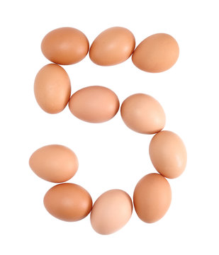 Number five made of Eggs. Isolated on white.